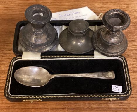 A silver mounted inkwell, candlesticks etc. Approx. 204 grams of gross weight. Est. £20 - £30.