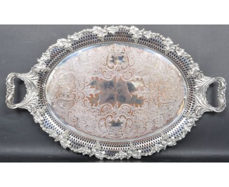A large 20th century silver plate salver / tray by Hutton &amp; Co. The tray having engraved floral decoration with foliate e