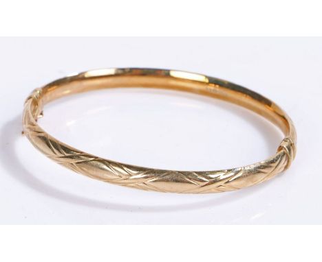 9 carat gold bangle with a cross pattern to the rim, gross weight 6.3 grams&nbsp;