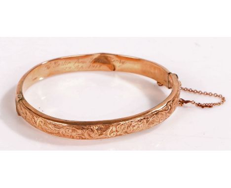 9 carat gold bangle with foliate decoration, diameter 6.5cm gross weight 8.9 grams&nbsp;