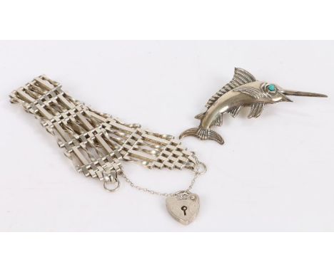 Silver gate bracelet together with a brooch depicting a sword fish with turquoise eye (2)&nbsp;