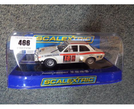 Scalextric - a rare Ford Escort Mk 1 London Mexico rally car, mint in mint transparent display case 