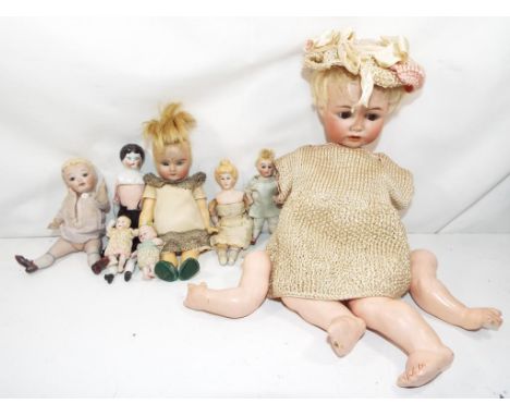 Vintage dolls - A good selection of Eight dolls, most with Bisque heads, some with sleeping eyes, One of the dolls requires r