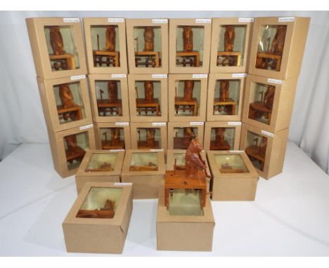 Twenty four novelty wooden carved bears playing golf in window boxes.