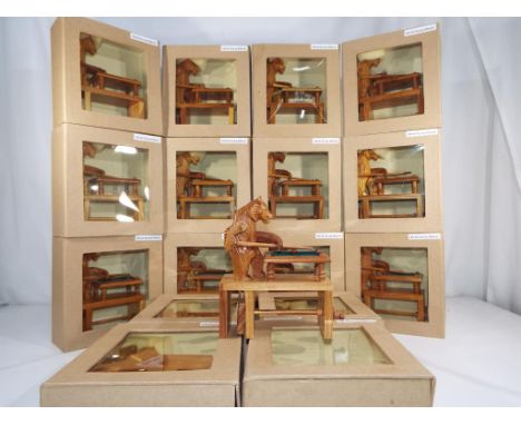 Sixteen unused novelty wooden carved bears playing billiards in window boxes.