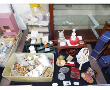 Doll's House Furniture - an Authentic Reproduction in Miniature Chippendale break front bookcase, a baker's trolley with lots