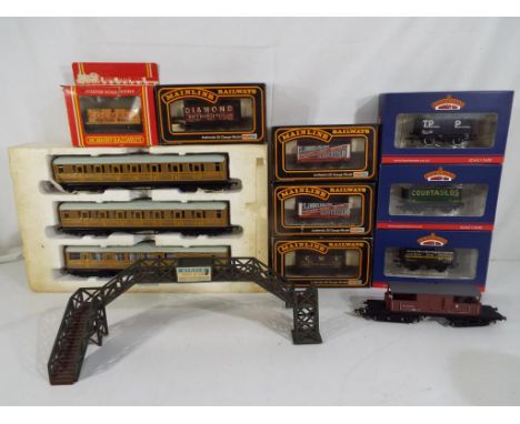 Model Railways - a lot to include three Bachmann OO gauge wagons, four Palitoy mainline railways wagons and a OO gauge Hornby
