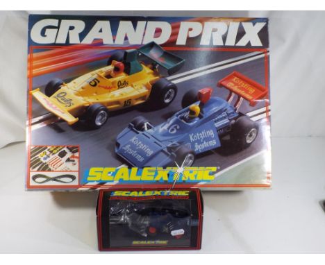 Scalextric - Grand Prix set, includes instructions, track, controllers, unused decals and three cars for spares. Item NM in N