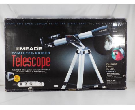 Telescope - Meade Computer Guide telescope in original box model # NGC-60 with instruction manual, astronomical star guide an