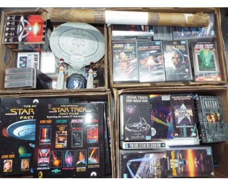 Star Trek - a good mixed lot to include in excess of 60 videos, nine ceramic plates, eleven fact files, posters and two model