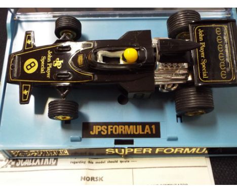 Scalextric - a John Player Special F1 racing car #C050 in near mint condition in original box with instructions