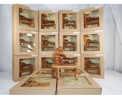 Sixteen unused novelty wooden carved bears playing billiards in window boxes.