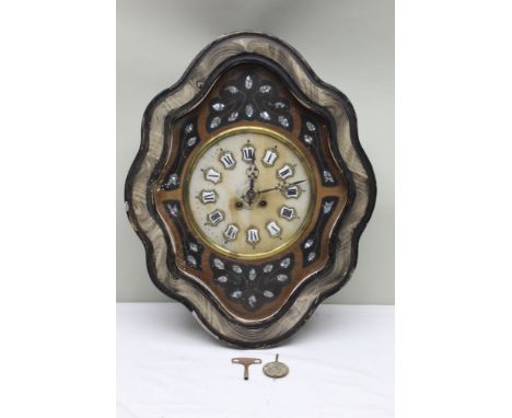 AN EARLY 20TH CENTURY CONTINENTAL WALL CLOCK in fancy shaped case, inlaid M.O.P. enamelled numeral 'shields', gong strike, 61