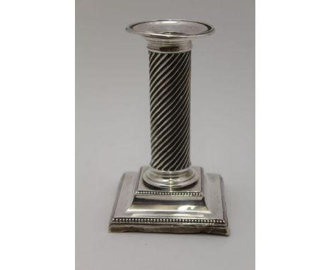 A LATE 19TH CENTURY SILVER CANDLESTICK, reed twist column on a square stepped base, Birmingham 1890, 13.5cm high 
