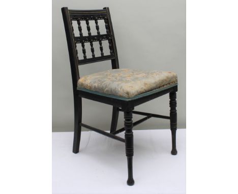 A LATE 19TH CENTURY AESTHETIC MOVEMENT EBONISED SINGLE CHAIR, two row bobbin back, gilded detail, on turned fore legs, overst