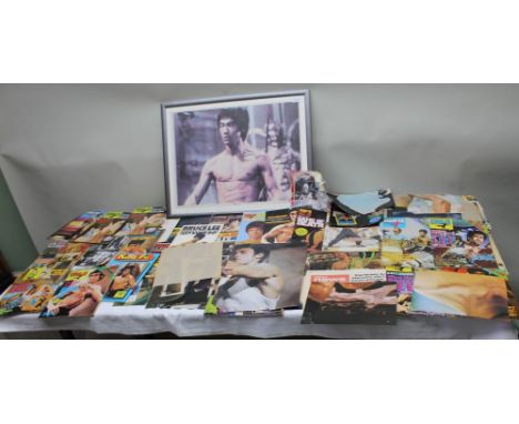 AN EXTENSIVE COLLECTION OF BRUCE LEE KUNG-FU PRINTED EPHEMERA to include; posters and magazines, one item signed by his widow
