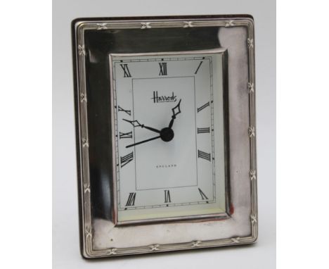 A 'HARRODS' SILVER FRAMED CLOCK, bound reed frame, Sheffield 1995, 12cm x 9cm 