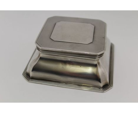ASPREY &amp; CO. LTD, A SILVER DESK INKWELL, square canted form, engine turned decoration, blind cartouche to hinged cover, g