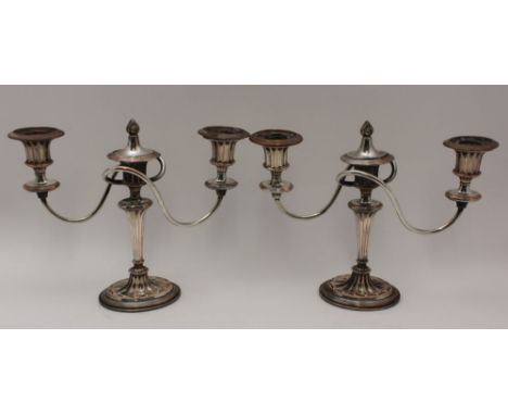 A PAIR OF OLD SHEFFIELD PLATE THREE LIGHT CANDELABRA of Adam style, twin branch form, on oval bases, 22cm high 