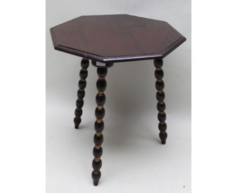 A 19TH CENTURY GYPSY CAT TABLE having traditional octagonal top supported on three part gilt bobbin turned legs, 66cm x 58cm 