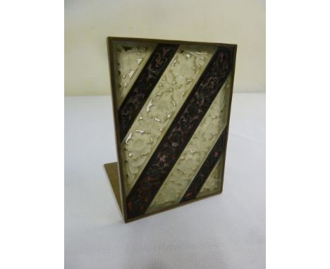 A Chinese late 19th century brass and jade bookend
