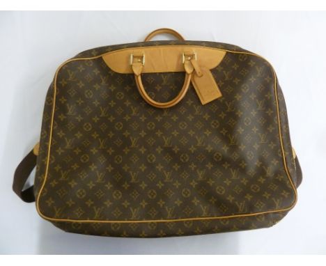 Louis Vuitton travel bag to include original locks, key and labels