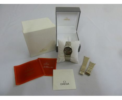 An Omega Constellation quartz chronometer wristwatch with steel strap and an additional strap in original case with documenta