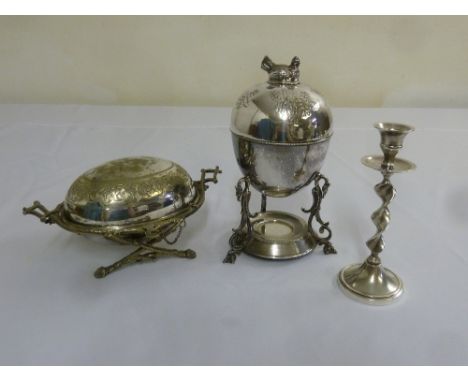 A silver plated butter dish, a silver plated candlestick and an egg warmer