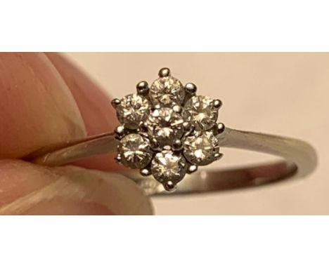 21ct WHITE GOLD RING WITH A CLUSTER OF SEVEN 0.07 DIAMONDS, SIZE M, WEIGHT APPROXIMATELY 2g

 