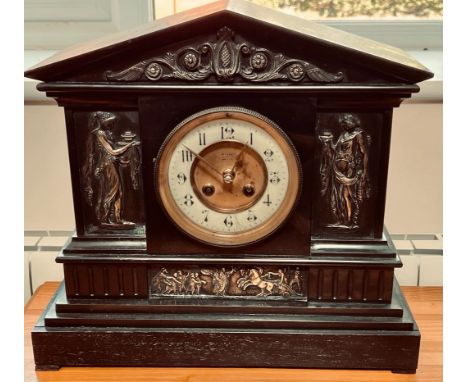 SLATE MANTLE CLOCK WITH CAST METAL PANELS IN THE CLASSICAL MANNER

 