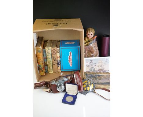 A box of mixed collectables to include vintage Enid Blyton books, Victory jigsaw puzzle, novelty nutcrackers, coins...etc. 