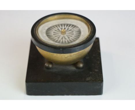 An early 20th century desktop compass. 