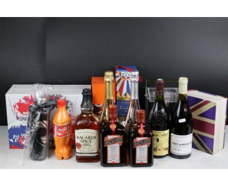 A collection of mixed alcohol to include Venice Dream, Domaine De Saint Prefect wine, Patron XO Cafe Tequila, Dolce &amp; Gab