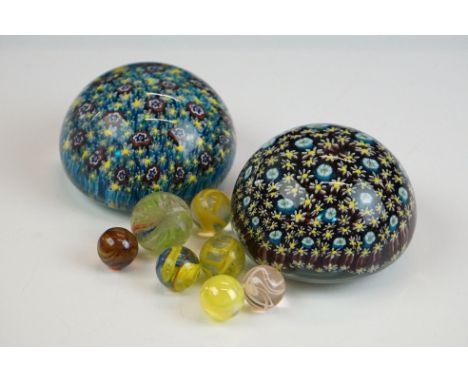 Two Murano millefiori glass paperweights of domed form, 7cm diameter, together with a small group of glass marbles (featuring