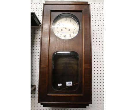 1930's Oak Cased Wall Clock, the silvered dial with Arabic numerals, 77cm high 