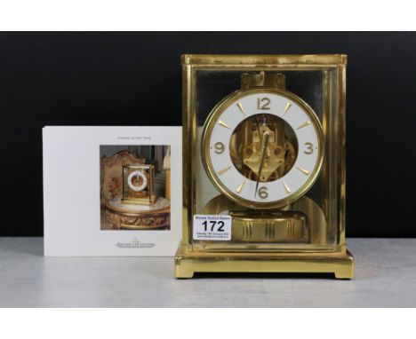 Jaeger Le Coultre Atmos Clock in glazed brass case, the white enamel chapter ring with applied batons and Arabic numerals at 