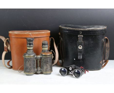 A collection of four pair of vintage binoculars to include Dolland and Barton examples. 