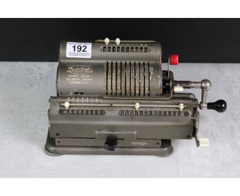 A vintage Muldivo mechanical calculator with turned side handle 
