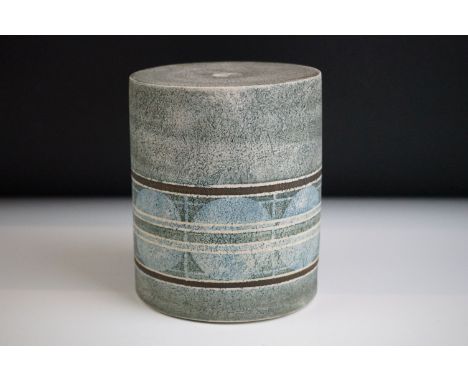 Troika pottery cylindrical lamp base decorated with a striped band of circles on a textured grey ground, signed 'Troika Cornw