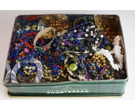 A collection of vintage and contemporary costume jewellery to include necklaces, brooches....etc. 