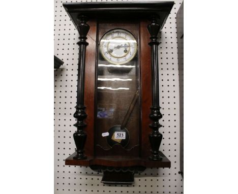 Late Victorian Walnut and Ebonised Wall Clock, the white enamel dial with Arabic numerals, 69cm high 