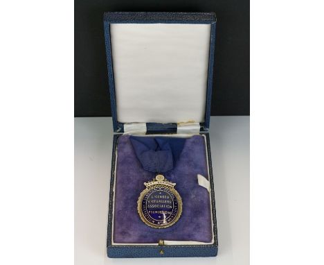 A fully hallmarked sterling silver and enamel medal from the licensed victuallers association.