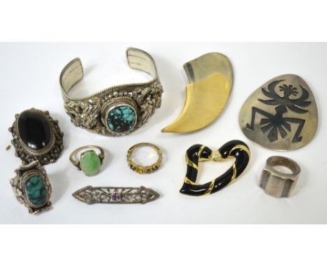 A small quantity of costume jewellery including a P&M of Paris abstract brooch, four further brooches, a bangle and four ring