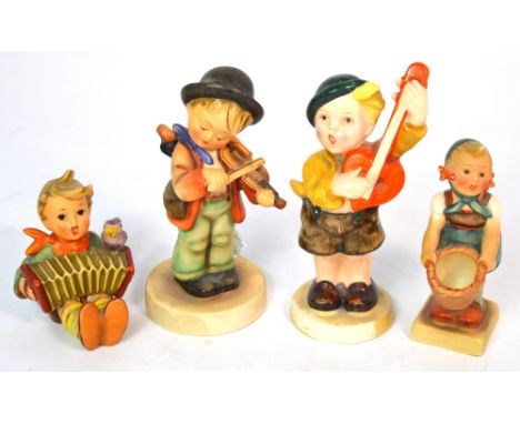 Four Hummel figures to include three musicians; a young boy playing a lute, one playing a violin, a seated child playing an a