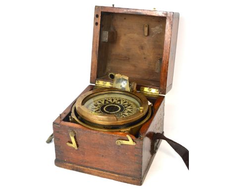 A 19th century maritime brass gimballed compass in wooden case, the dial inscribed 'Kelvin, Bottomley & Baird Ltd., Captain C