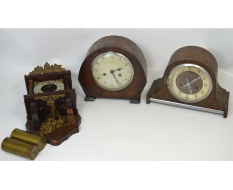 Two mid twentieth century oak cased mantel clocks to include an Enfield 8 day example, silvered dial set with Arabic numerals