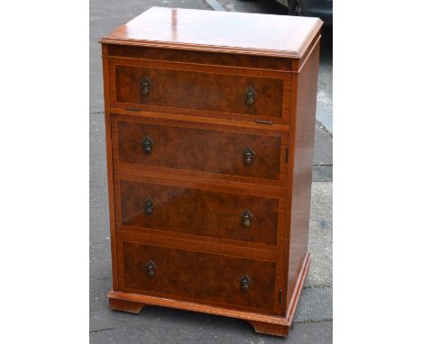 A walnut HMV record cabinet with Charles Sheraton of Leeds label to interior with four false drawers to the front on bracket 