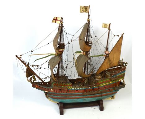 A scratch built scale model of a ship 'Golden Hind' on accompanying stand, length approx 70cm.