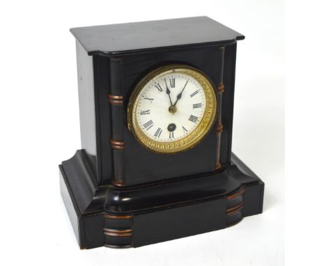 A c.1900 ebonised wooden mantel clock the enamel dial with Roman numerals, faux bamboo pillars to either side, height 21cm.