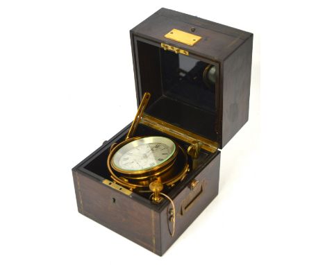 A 19th century coromandel cased brass two-day marine chronometer, the upper hinged lid revealing a glazed inner section openi